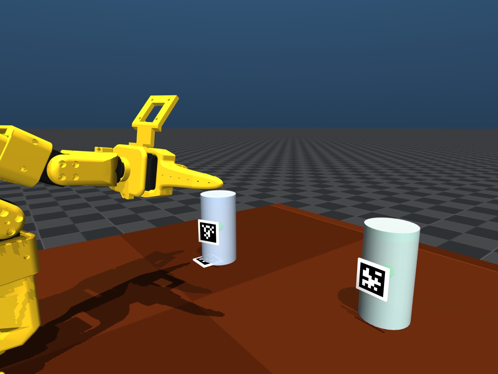 MuJoCo render of the simulated SO-101 arm reaching toward two cups with AprilTags mounted on them